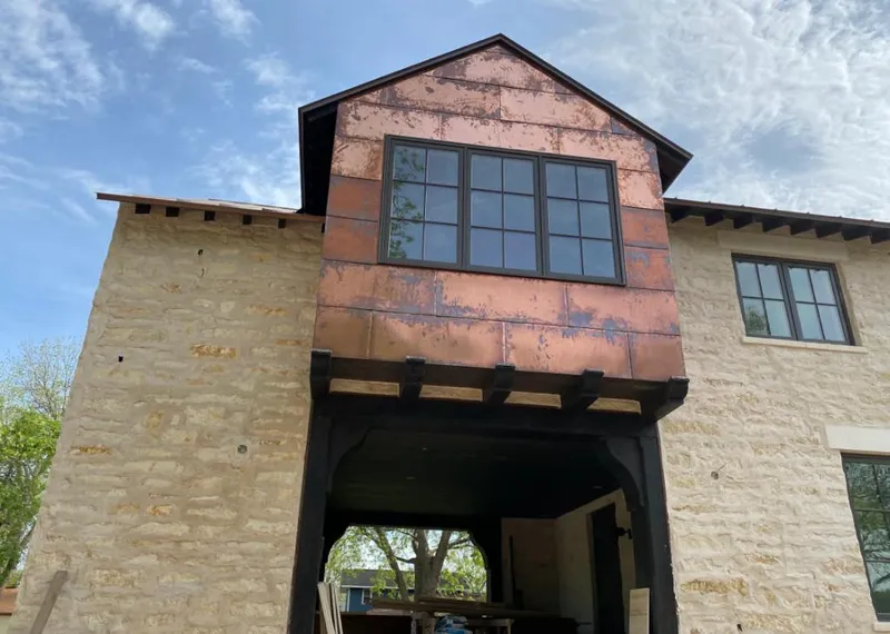 Copper metal panel facade on a stone building for Metal Roof Coating in Bella Vista
